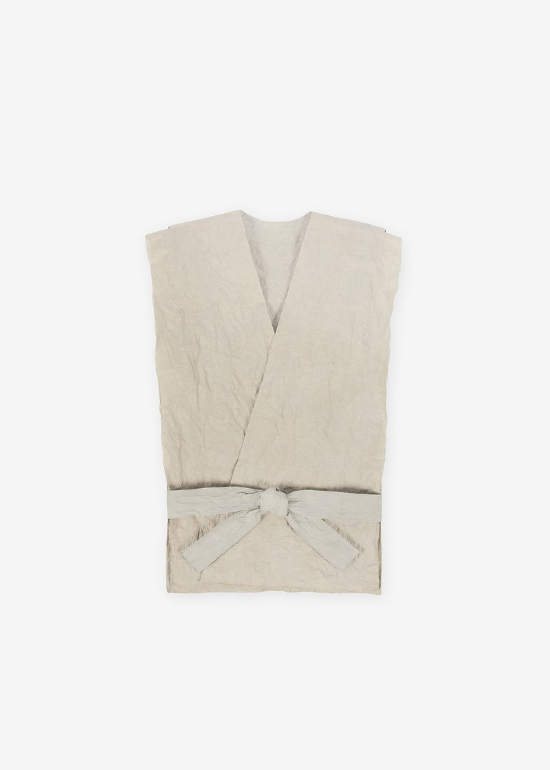 10. Kamikoromo kimono vest - wildflower herbal dyeToday, kozo, mitsumata and gampi are the principal raw materials for washi. Kozo is prized for its long, tough fibers. Kozo is cut at the root and steamed in a barrel over a fire in order to separate the bark. The bundles of fibers are placed in a cold stream for one to three days. The branches are boiled and stripped of their outer bark and then dried. The fibers are then boiled, placed in running water, and naturally bleached. The rinsed fibers are placed in a strainer floating in water for further cleaning and then laid on a board and beaten. Once they have dried overnight and have been softened by stamping or hand-rubbing, they are ready to be made into washi.