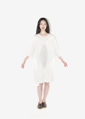 59. Geometric patterned dressDress composed of organic cotton single jersey and finest linen-wool fabric. The linen-wool part is composed of plain-woven fabric and twilled fabric.