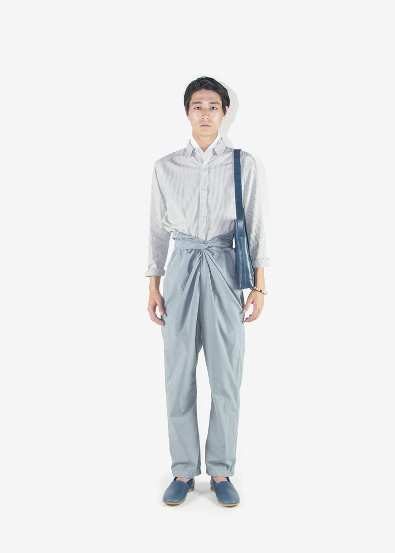 57. Oxford shirt - logwood herbal dyed stripeFly front, soft textured shirt made of organic cotton oxford. The sumi-gray stripes comes from a logwood herbal dyed organic cotton threads. Worn with organic cotton broad cloth blue-gray color wrapped pants, naturally tanned leather shoes and shoulder bag.