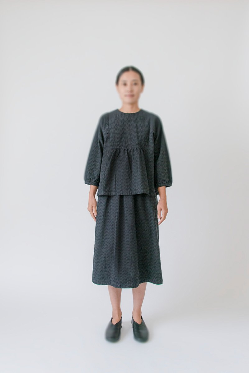17. Sashiko blouse, Sashiko gathered skirtFabric woven with sashiko techniques using shuttle weaving machine. Fabric is composed of organic cotton for the warp, and alternate layers of hemp threads and organic cotton for the woof. Sashiko stitches are cross woven with twisted hemp threads.