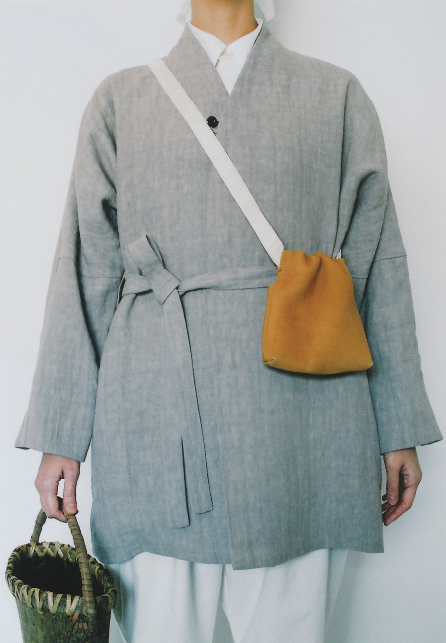 Jomon tanned and smoked leather drawstring bag, Japanese wing nut tree hand basket.