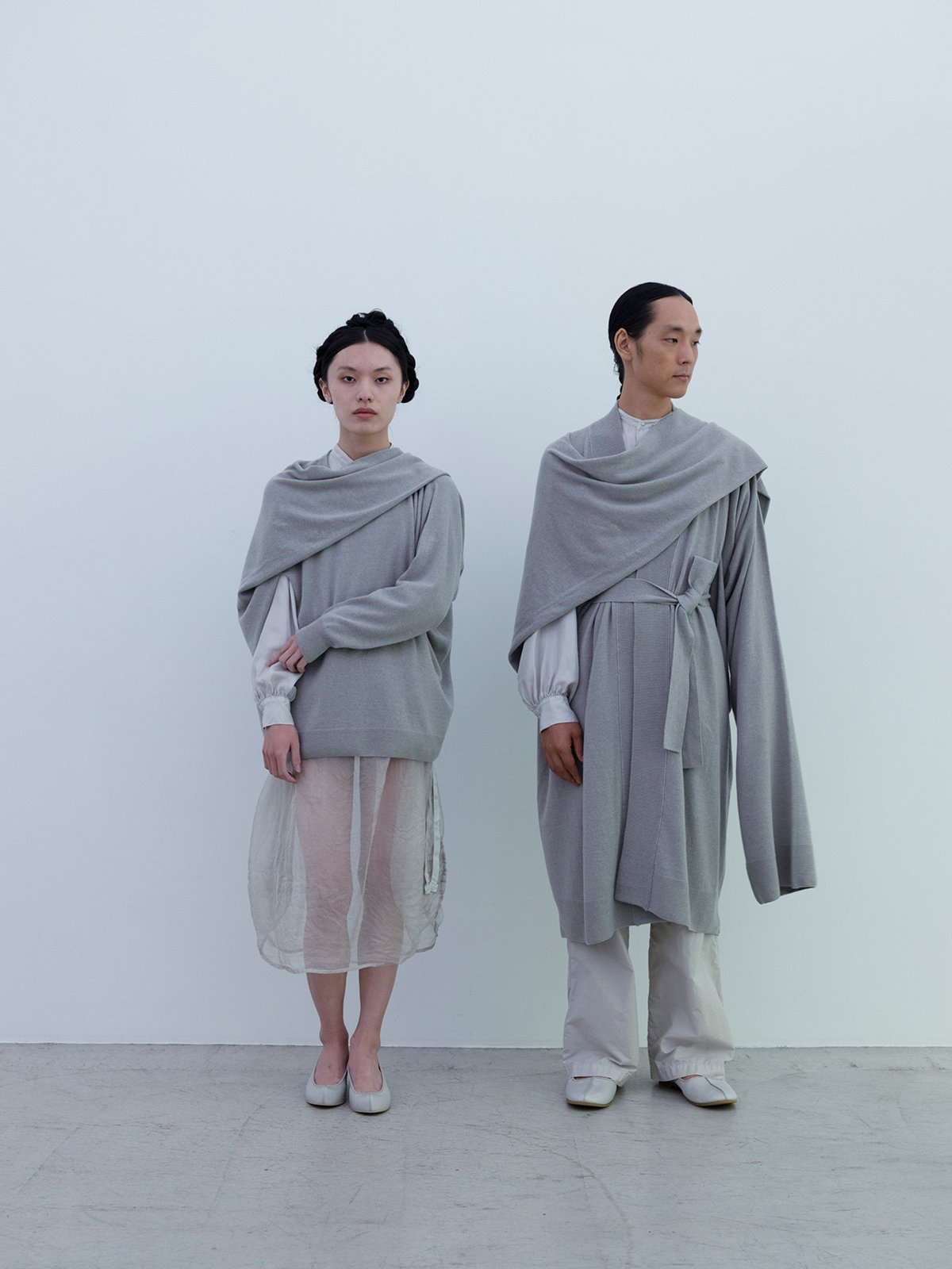 Left / Cashmere sweater, Jade colored silk tweed classic shirt, Jade colored Silk organdie drawstring bag skirt, Deerskin “koshin” folk pumpsRight /Cashmere cardigan, Jade colored silk twill classic shirt, Cotton linen classic broadcloth work pants, Deerskin folk shoes