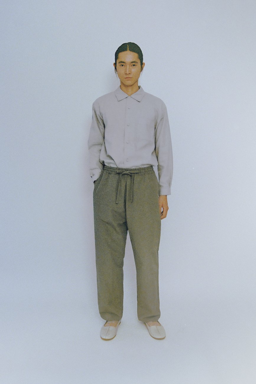 Folk dress pants with pleated tucks in the front.