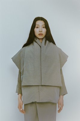 Organic shaped dawn vest and scarf. Down vest with unique sleeves. Down scarf is lightweight and very warm.